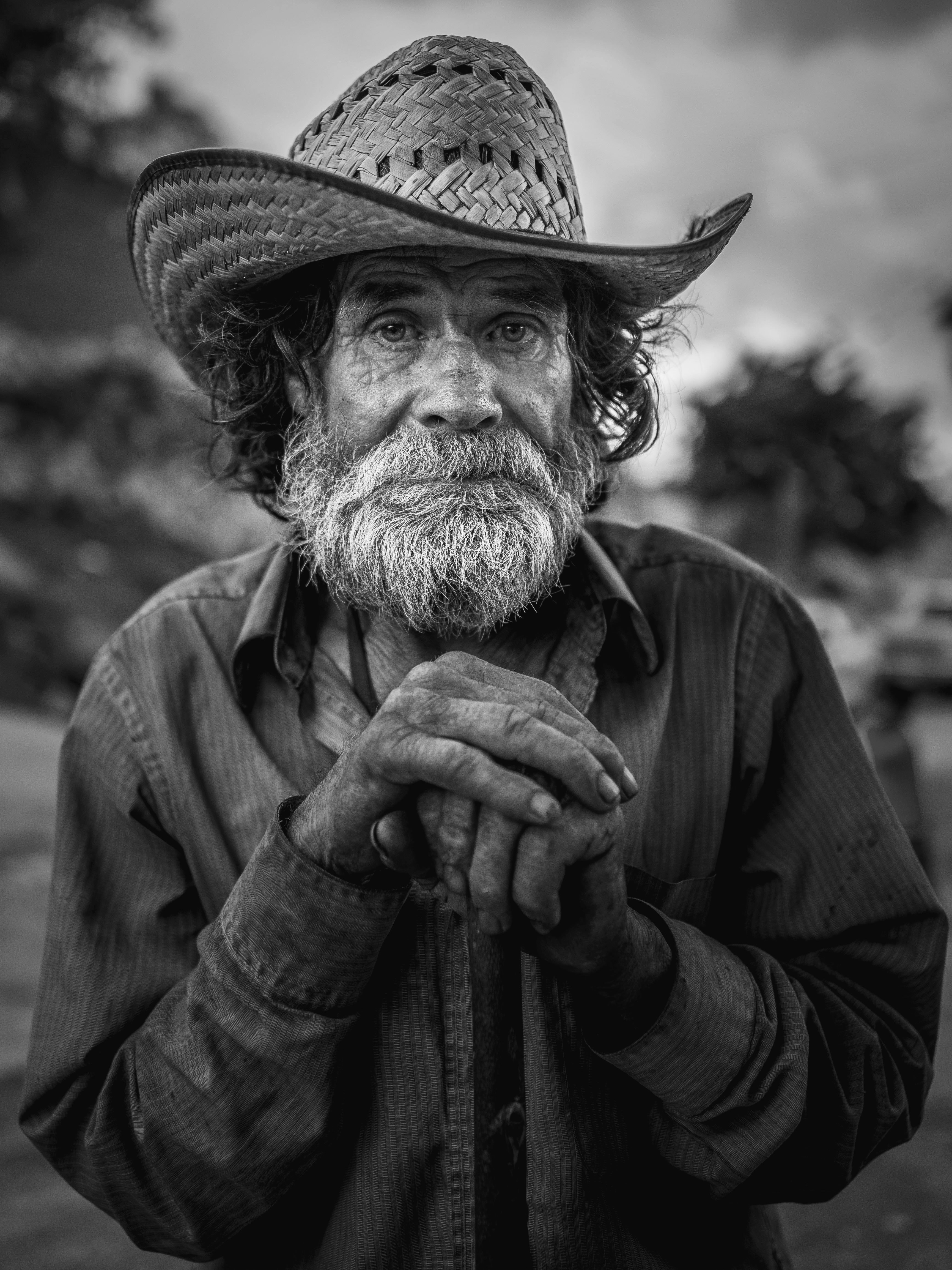 man in cowboy hat and coat